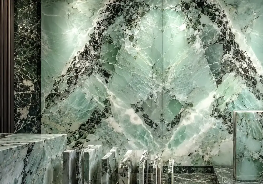 Verde Alpi Marble slabs displayed in a premium material gallery with elegant wall applications and finish samples