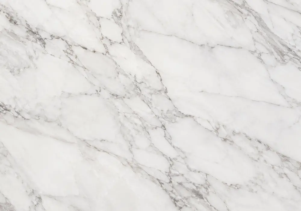 Polished Persian Green marble slab with sage and forest tones, luminous white ribbons, dark branches and subtle gold accents.