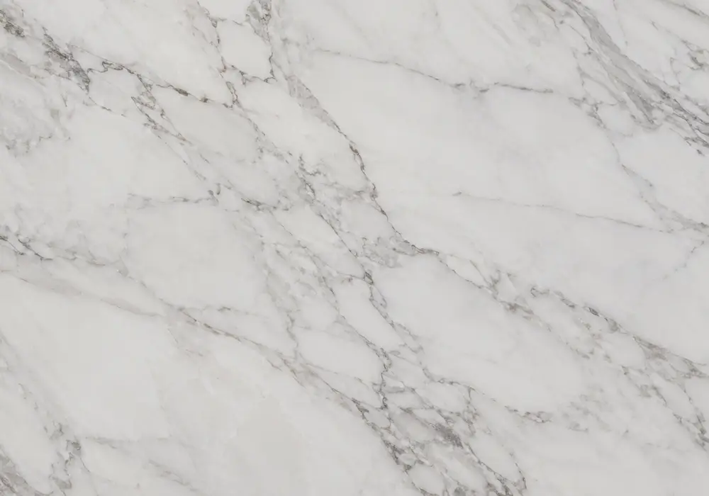 Verde Guatemala Marble console tabletop in a premium stone showroom with upright slabs and refined interior finishes