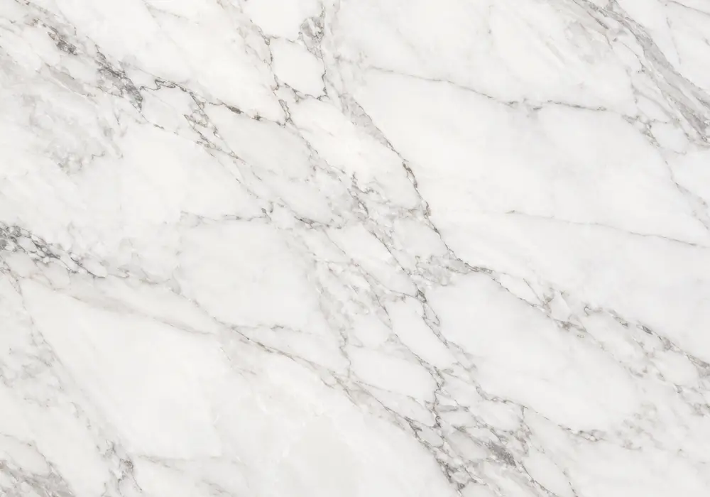 Emerald, jade and forest tones flow with pale veins across Verde Marble, representing the diverse green marble category.
