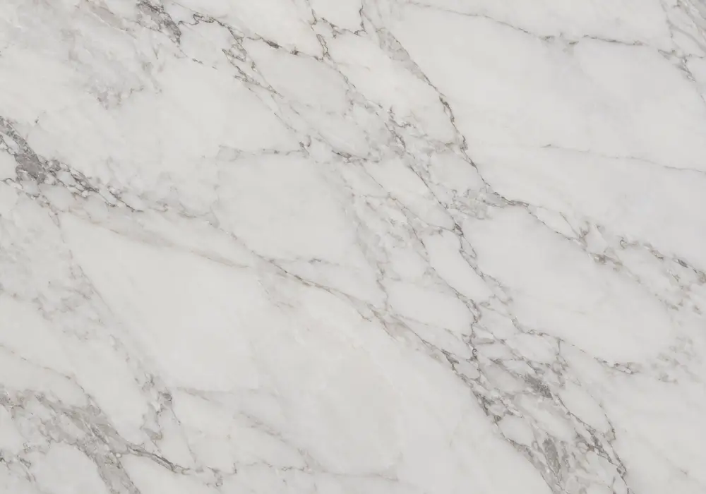 Fine silver veins feather across cool White Carrara Marble, revealing classic Carrara Apuan Alps stone character and depth.