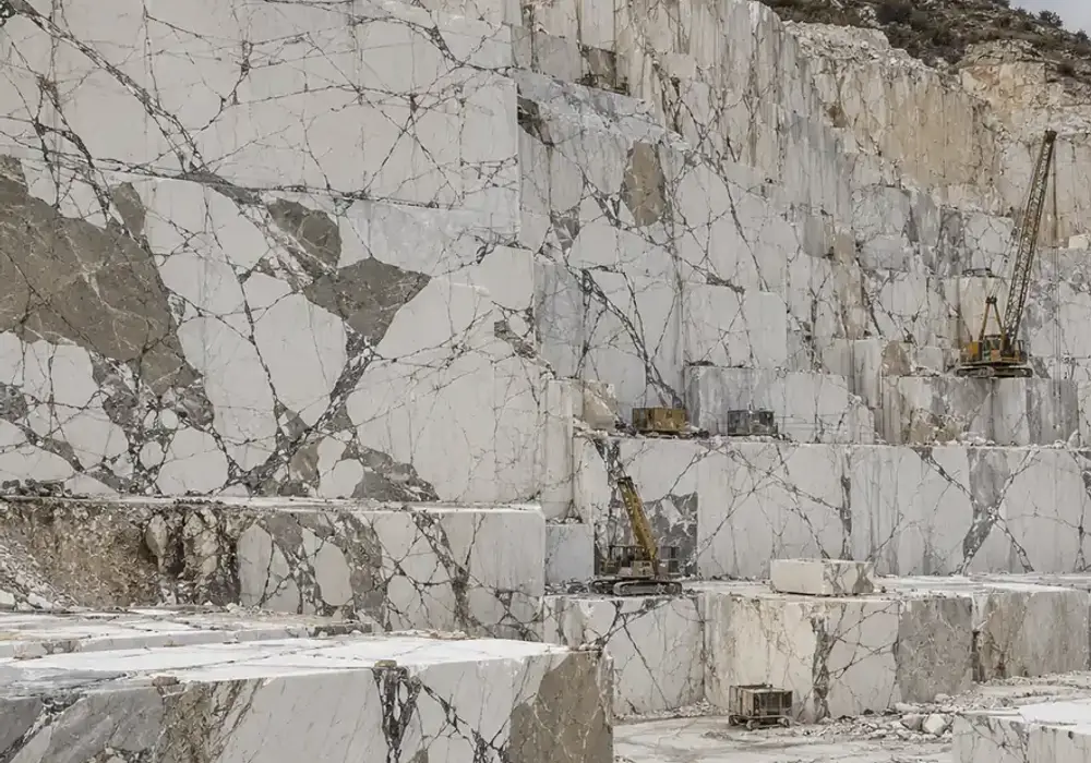 White Grey marble bookmatched wall panel with bright stone and mirrored soft-grey natural veining