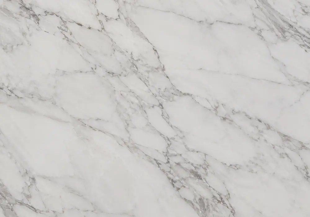 Italian white marble slabs shown as distinct Carrara, Calacatta, Statuario and Arabescato looks across a luxury interior.
