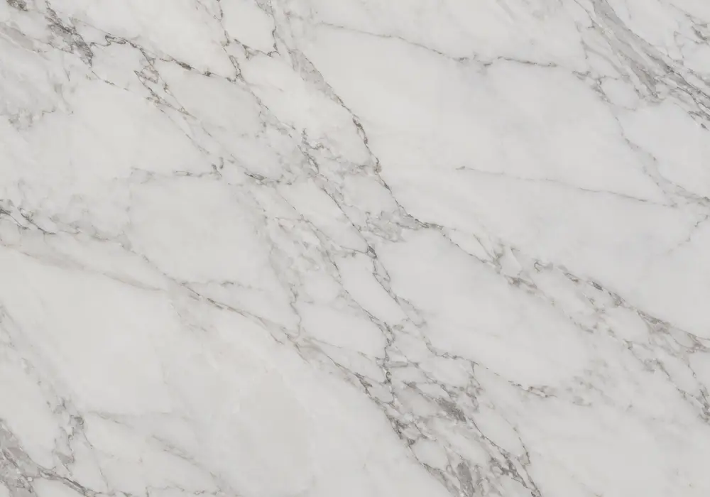 Greek white stone in a luxury bathroom and spa, showing authentic veining, natural stone depth and refined interior detail.