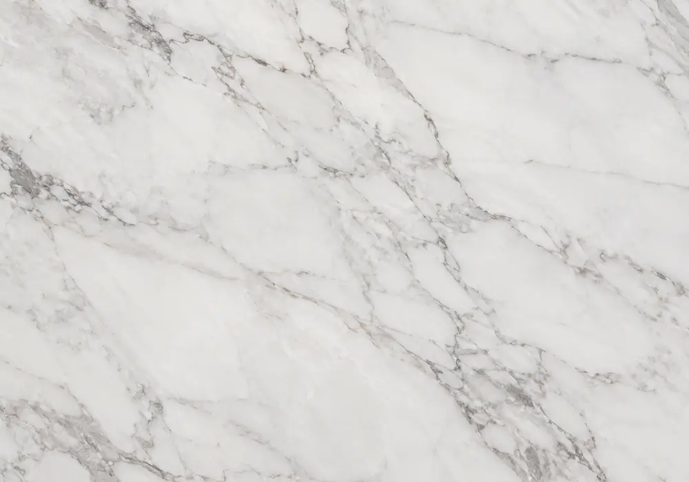 White marble with gold veins fireplace surround with luminous pale stone and flowing warm gold mineral lines