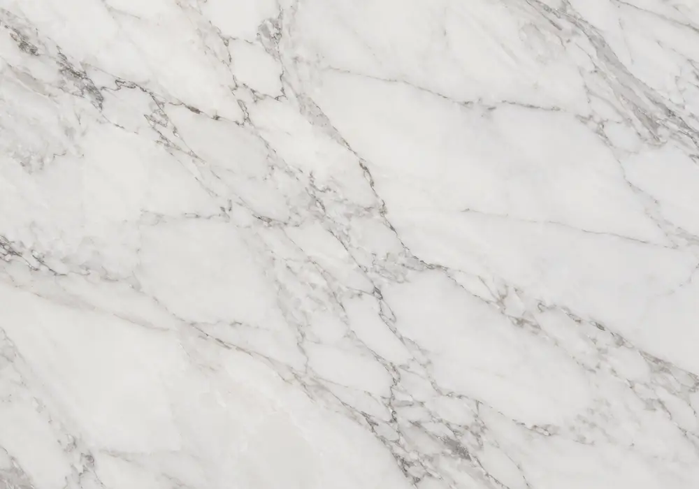 white marble red veins price image: white and red, brecciated fragments and branching veins, with clear geological character.
