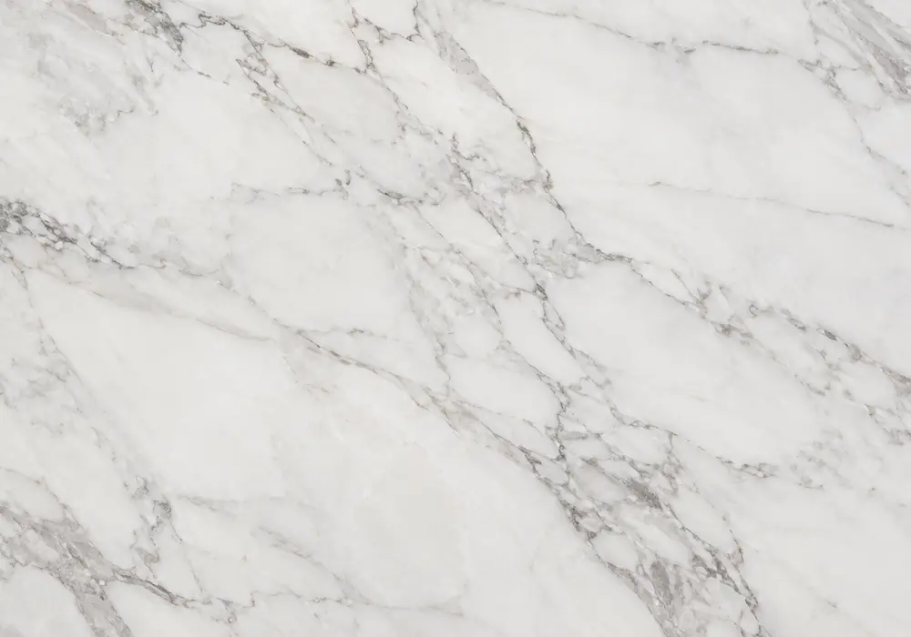 Italian Statuario marble in a master bathroom, with authentic veining, polished surfaces and refined architectural detail.