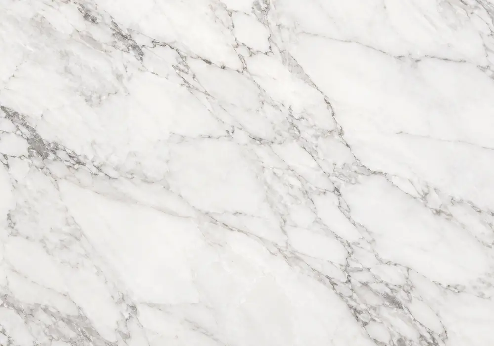 White Thassos marble luxury fireplace surround with brilliant crystalline white stone and extremely subtle pale-grey lines.