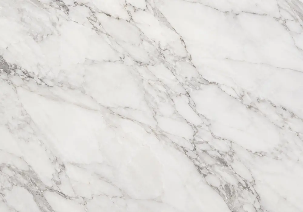 crystalline snow white marble slabs with sugar-like sparkle shown polished, honed and textured beside project-ready UAE tiles
