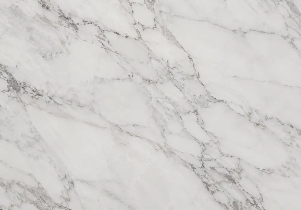 wood grain marble UAE across aligned hotel walls, vanity and countertop with fine grey-taupe lines over soft ivory stone.