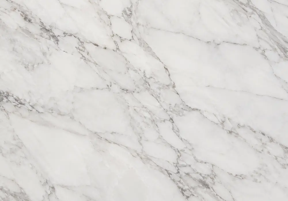 Indian beige marble on polished countertop, vanity and dining table with warm cream, peach and dusty-pink cloudy movement.