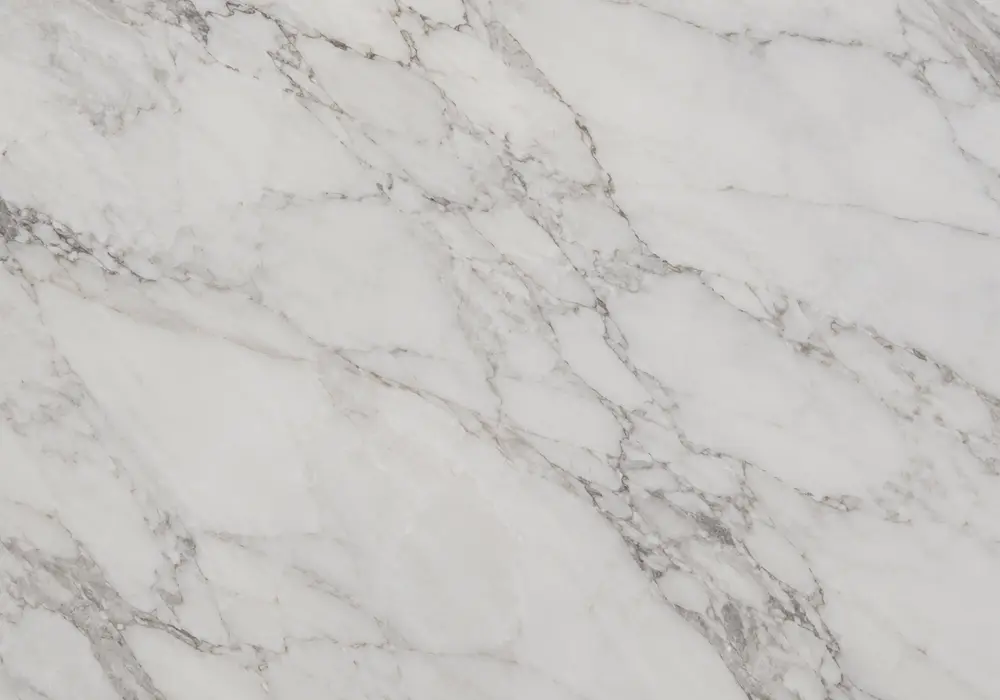 wood vein marble types visual of brown and grey stone shaped by flowing waves and natural veining, across a luminous surface.