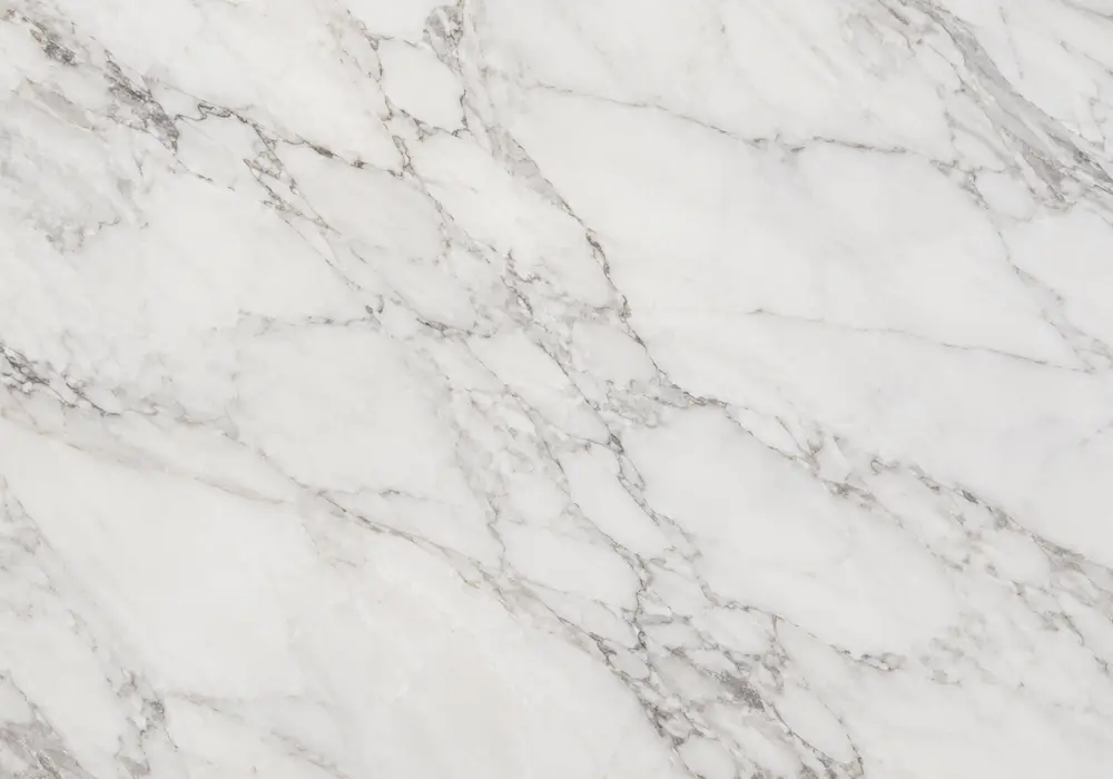 Ziarat White Marble console tabletop in a refined stone showroom with natural slab displays and polished surfaces