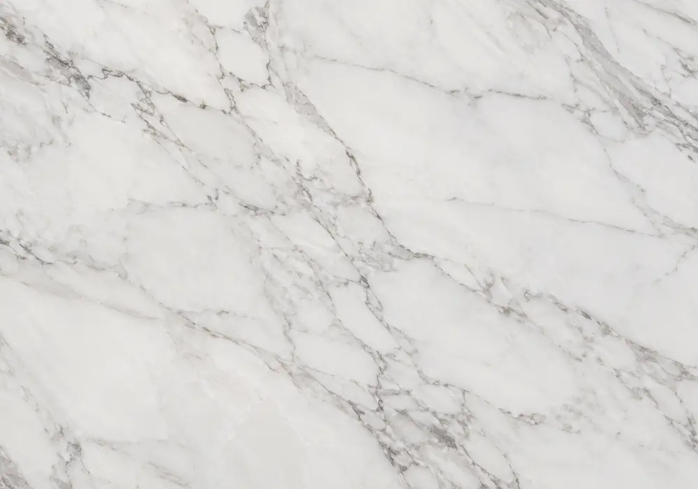 Ziyarat flooring with polished countertops, honed stairs and bathroom surfaces in milky white stone with silver-grey veining.